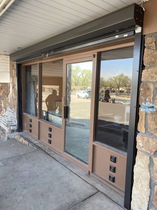 Outdoor security shutter with interlocking slats.