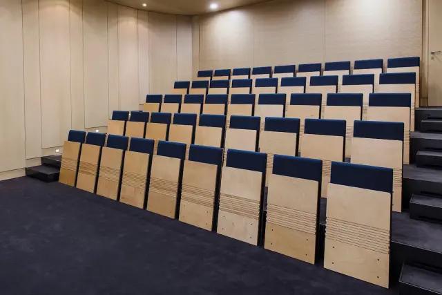 Folding angled floor mounted seating