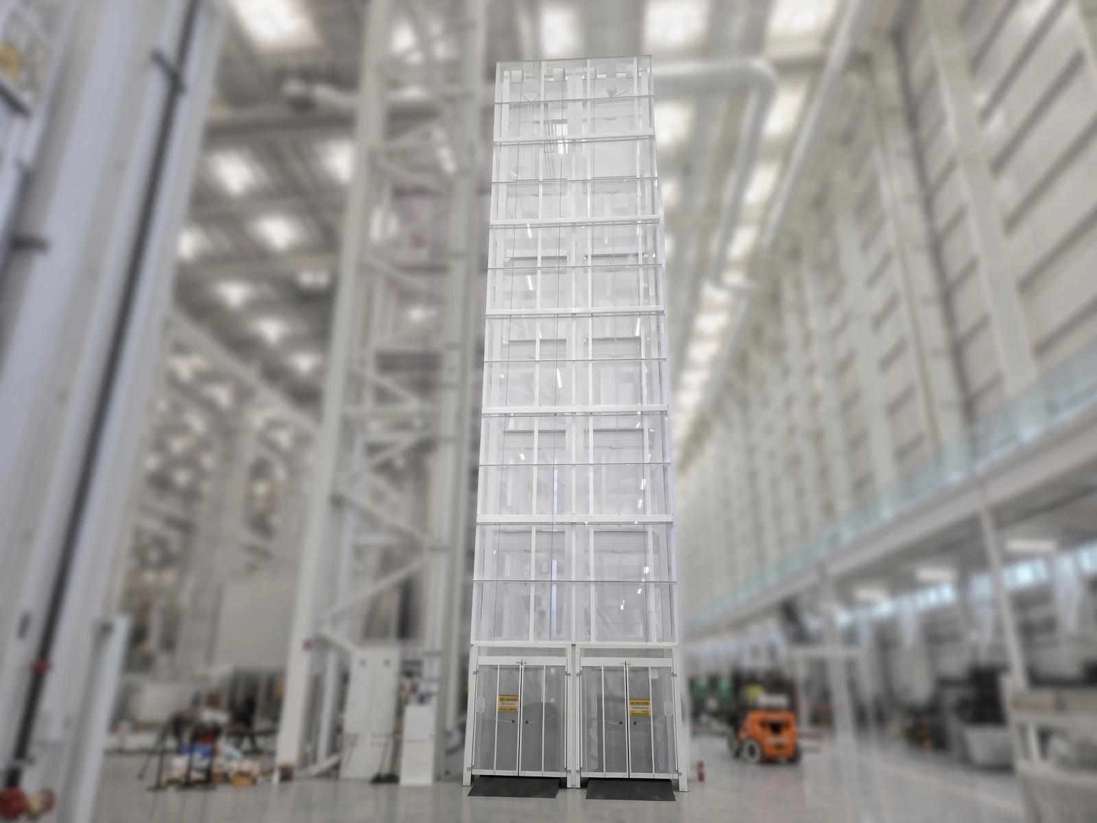 Material handling vertical reciprocating conveyor for transferring loads between floor levels.